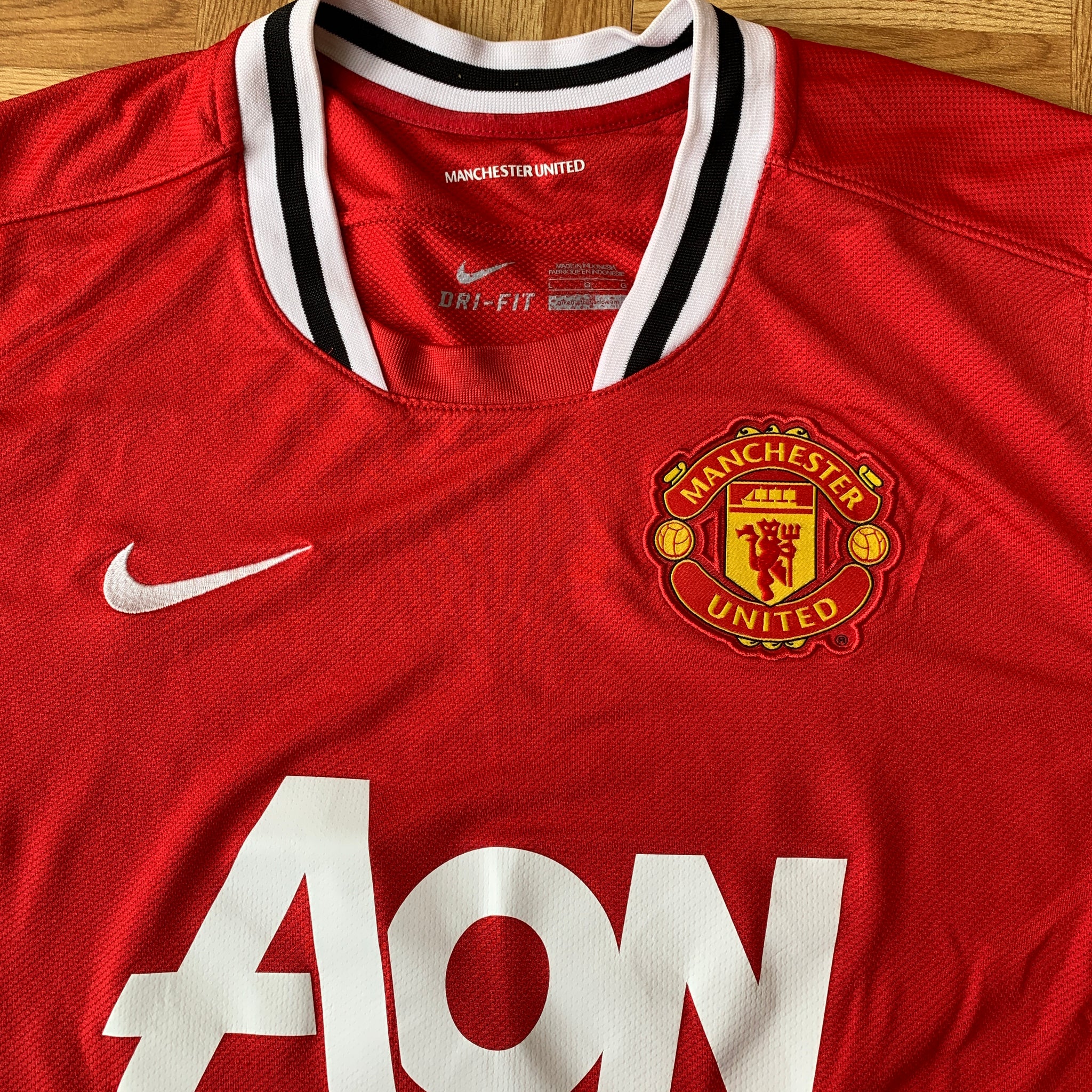 Manchester United Home football shirt 2011 - 2012. Sponsored by AON